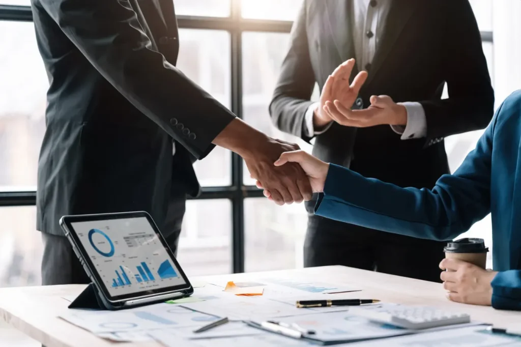 Businessmen in suits shaking hands