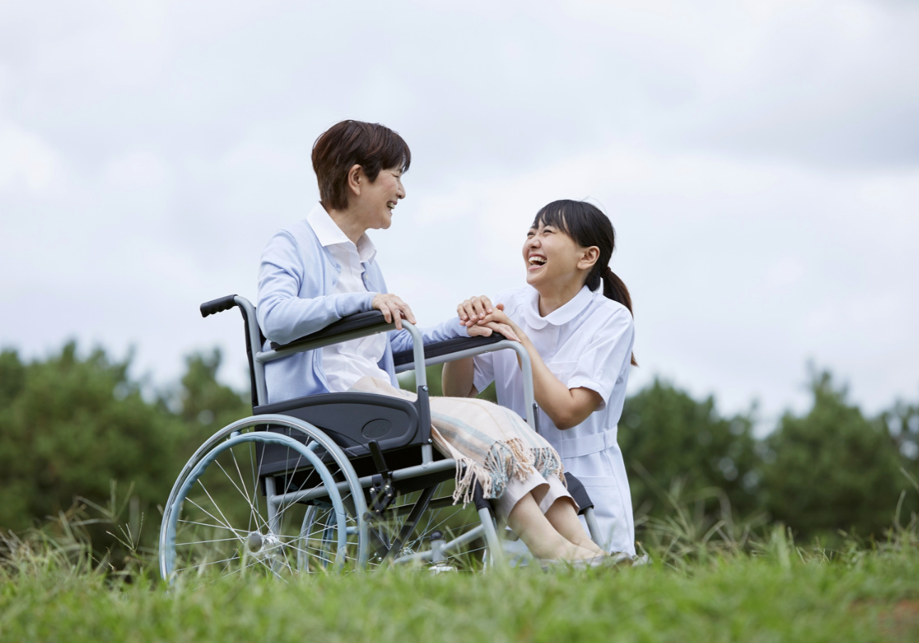 caregiver offering support to elderly