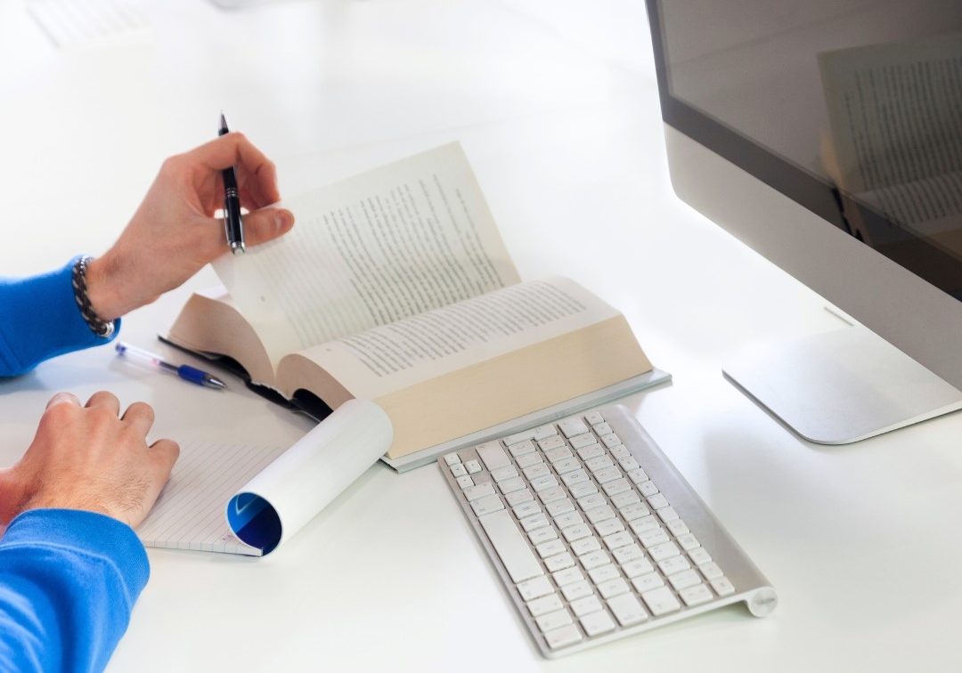 person studying another language by reading a book